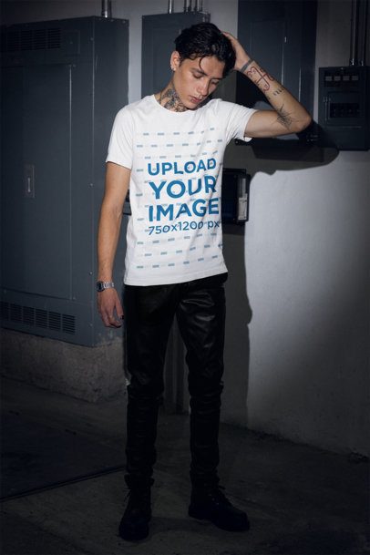 Bella Canvas Tee Mockup Featuring a Tattooed Man Posing With a Gothic Style