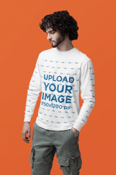 Mockup of a Curly-Haired Man Standing in a Studio Wearing a Comfort Colors Long-Sleeve Tee m53185