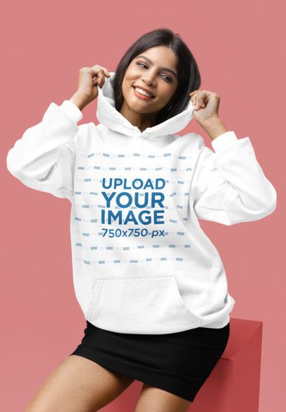 Comfort Colors Pullover Hoodie Mockup of a Cheerful Woman Posing in a Colorful Studio m53153
