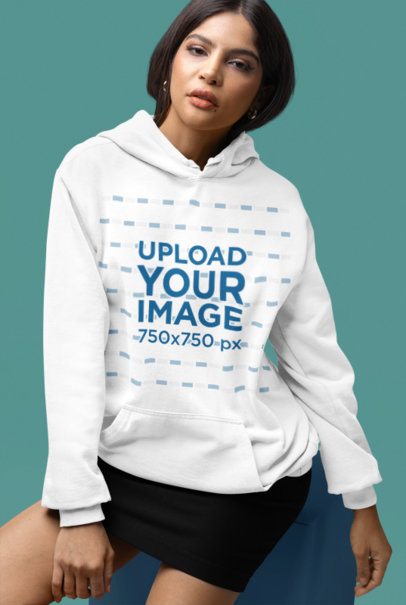 Comfort Colors Hoodie Mockup Featuring a Woman Sitting in a Colored Cube in a Studio m53154