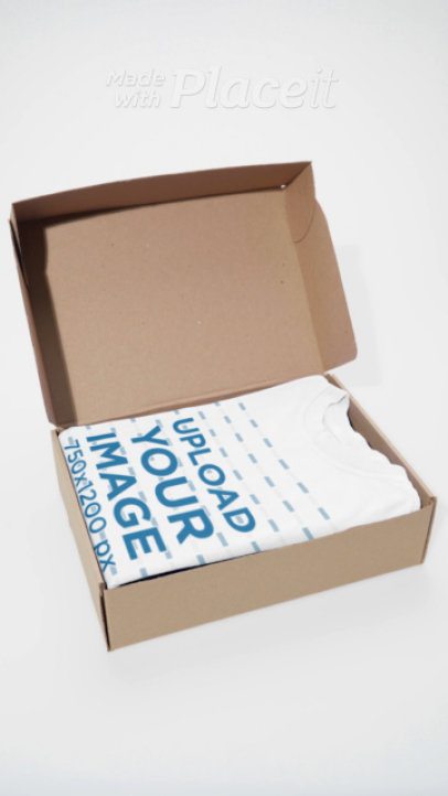 Video of an Open Cardboard Box With an Oversized T-Shirt 9026v