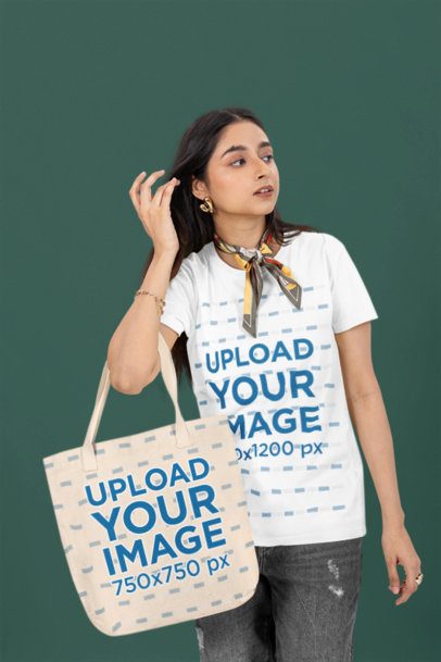 Round-Neck T-Shirt Mockup Featuring a Woman With a Tote Bag Wearing a Silk Scarf