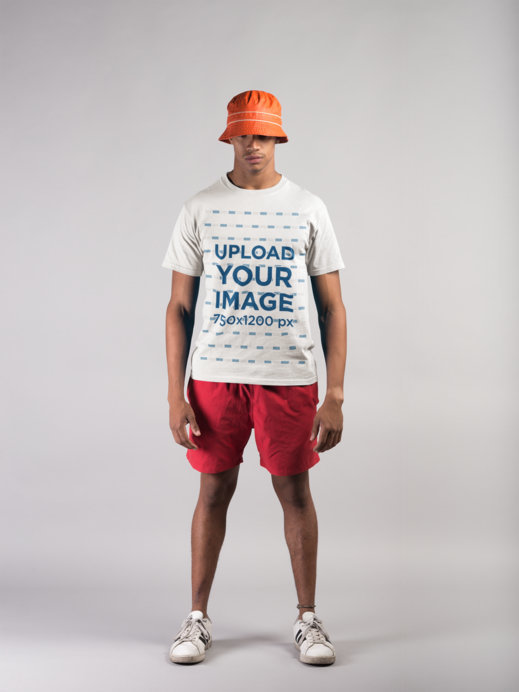 T-Shirt Mockup Featuring a Man Wearing Beach Clothing in a Photo Studio