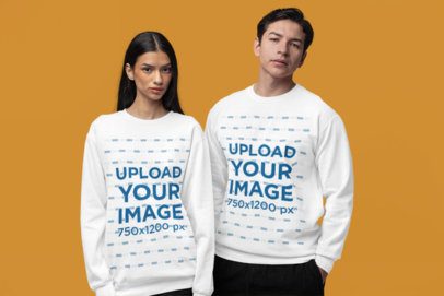 Mockup of a Man and a Woman Standing in a Studio Wearing Comfort Colors Sweatshirts m53004