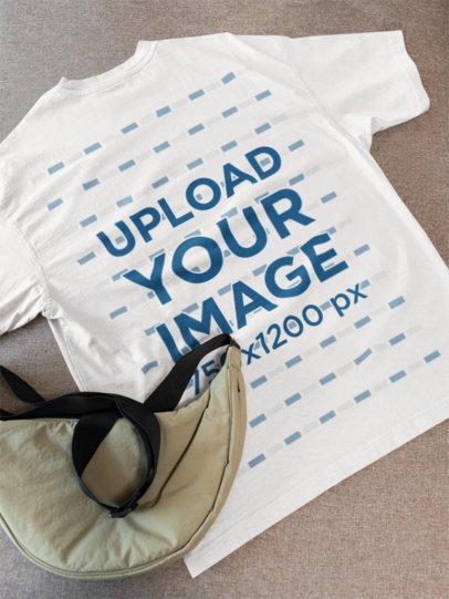POV-Themed Mockup Featuring an Oversized T-Shirt Lying on the Floor With a Bag m52009