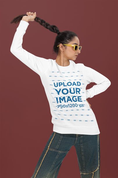Bella Canvas Long-Sleeve Tee Mockup Featuring a Woman Grabbing Her Braid in a Studio