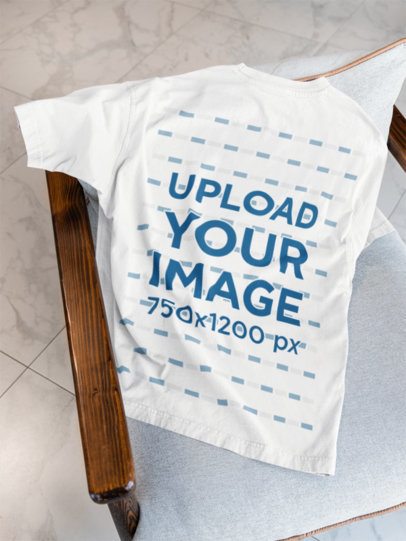 Mockup of the Back-View of an Oversized T-Shirt Placed on a Chair