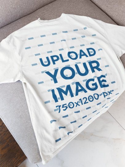 Back-View Mockup of an Oversized T-Shirt Placed on a Couch