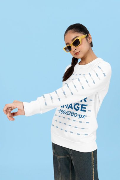 Bella Canvas Long-Sleeve Tee Mockup Featuring a Woman With Sunglasses Standing Over a Colorful Backdrop