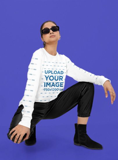 Bella Canvas Long-Sleeve Tee Mockup of a Cool Woman Striking a Pose in a Studio