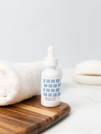 Print Mockup Featuring a Hyaluronic Acid Complex Serum Placed on a Wooden Surface m53601