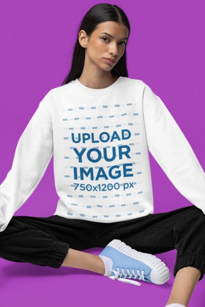 Comfort Colors Sweatshirt Mockup Featuring a Woman Sitting on a Colorful Surface m52971