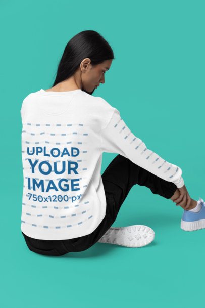 Back-View Mockup of a Woman Sitting on the Floor While Wearing a Comfort Colors Sweatshirt m52973
