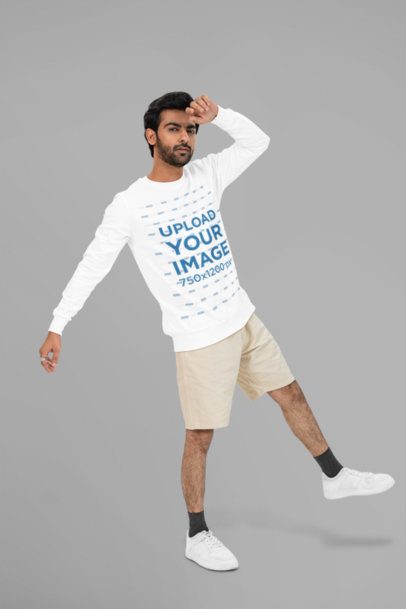 Bella Canvas Long-Sleeve Tee Mockup of a Bearded Man Posing Against a Customizable Wall
