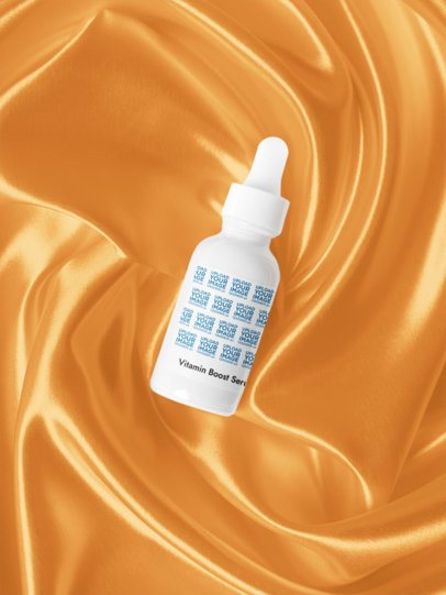 Vitamin Boost Serum Mockup Featuring a Shiny Silk Background