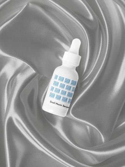 Snail Mucin Facial Serum Mockup Featuring a Nice Silk-Styled Background m53614