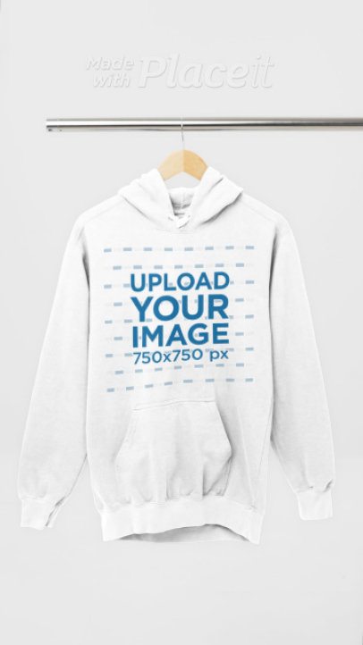 Video of a Pullover Hoodie by Comfort Colors Placed on a Wooden Hanger 9039v