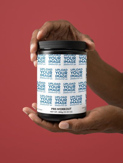 Pre-Workout Watermelon Supplement Mockup Featuring a Man's Hands Against a Colorful Wall