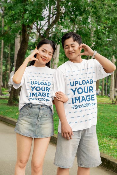 Oversized Tee Mockup Featuring a Cute Couple Making Hearts With Their Hands for Valentine's Day