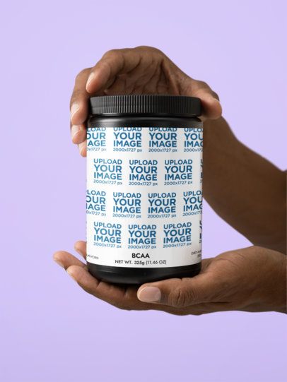 BCAA Grape Supplement Mockup Featuring a Pair of Man's Hands in a Colorful Setting