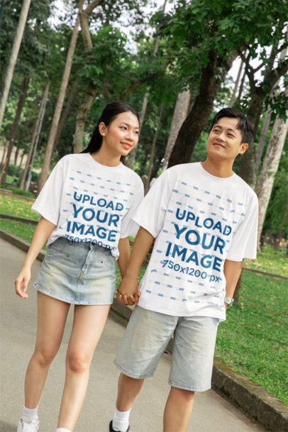 Oversized Tee Mockup of a Sweet Couple Walking in the Park Holding Hands