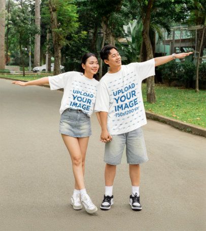Mockup of a Sweet Happy Couple Walking in the Park Wearing Oversized Tees