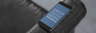 Mockup of a Black iPhone 6 at a Corporate Lounge