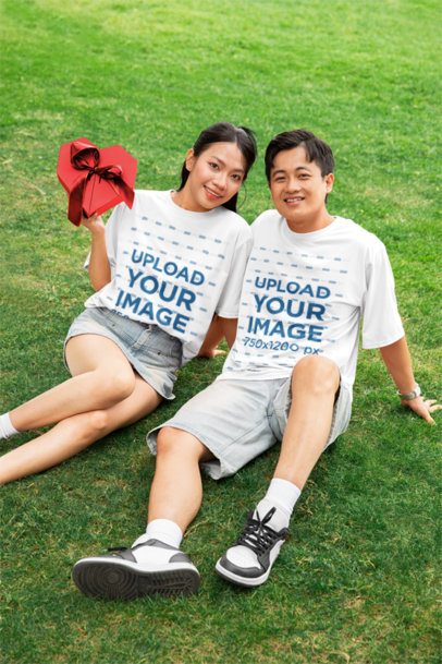 Romantic Mockup of a Sweet Couple in Matching Oversized Tees Celebrating Valentine's Day