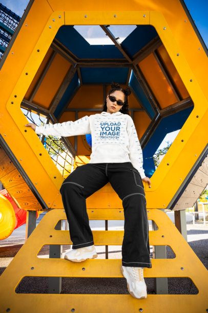 Comfort Colors Mockup of a Woman in a Hoodie Posing in a Playground m53353