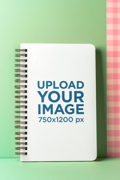 Mockup of an AI-Generated Spiral Journal Lying on a Colorful Surface m53856