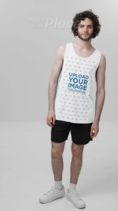Comfort Colors Tank Top Video Featuring a Bearded Curly-Haired Man Standing in a Studio
