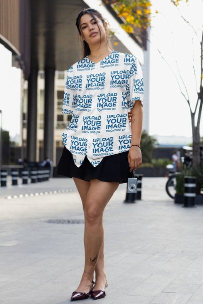 Baseball Jersey Mockup Featuring a Tattooed Woman Standing in the Street With a Camera m54454