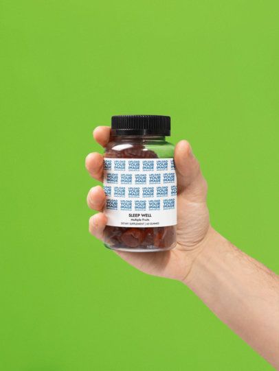 Sleep Well Gummies Supplement Mockup Featuring a Man's Hand Against a Colored Surface m53585