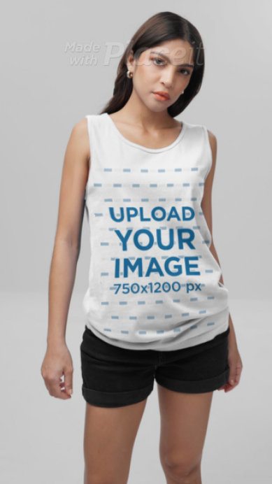 Comfort Colors Tank Top Video of a Brunette Woman Posing With a Serious Look in a Studio