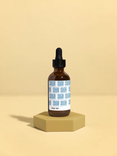 Hair Oil Mockup Featuring a Colorful Base and a Customizable Background m53596