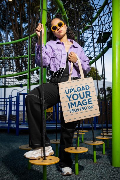 Tote Bag Mockup of a Woman With Sunglasses Posing in a Playground Park m53367
