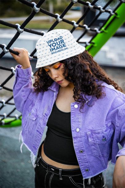 Sublimated Bucket Hat Mockup Featuring a Woman Posing in a Park