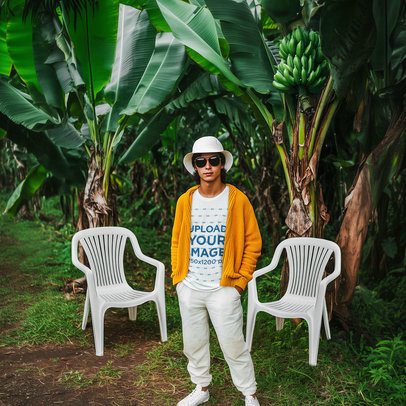 Round-Neck Tee Mockup of an AI-Generated Man Posing in a Patio With Two Plastic Chairs m54470