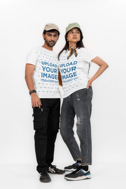 T-Shirt Mockup of a Serious Man and a Woman Posing in a Studio With Stylish Looks