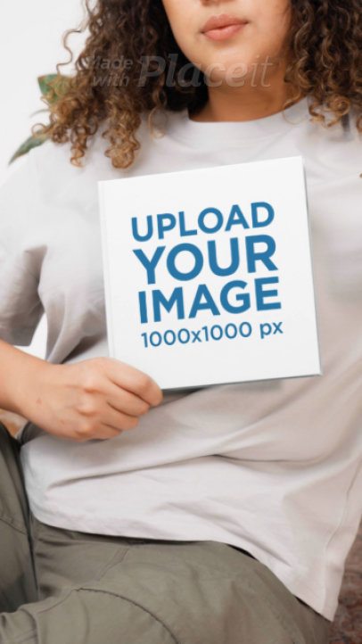 Video of a Woman Drinking From a Cup While Looking at a Squared Book 9067v