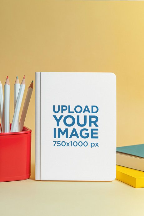 Mockup of an AI-Generated Hardcover Journal Surrounded by School Supplies