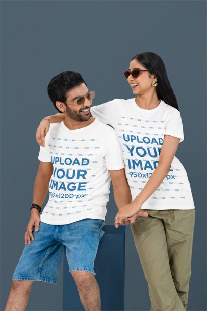 T-Shirt Mockup Featuring a Happy Couple Posing Against a Customizable Background