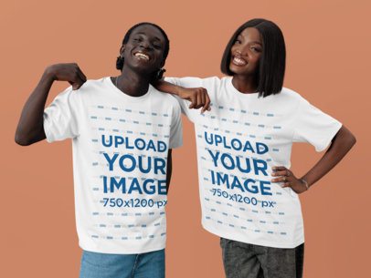 Oversized T-Shirt Mockup Featuring a Cheerful Man Posing With a Smiling Woman in a Studio