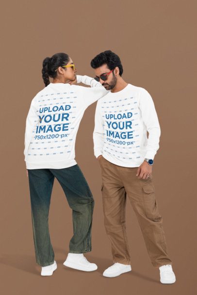 Bella Canvas Long-Sleeve Tee Mockup of a Couple Standing in a Studio With Serious Looks
