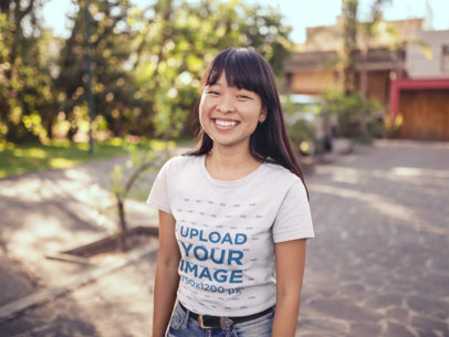 T-Shirt Mockup of an Asian Woman Outside her House