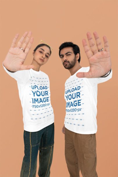 Bella Canvas Long-Sleeve Tee Mockup of a Man and a Woman Posing With Their Hands in Front of the Camera