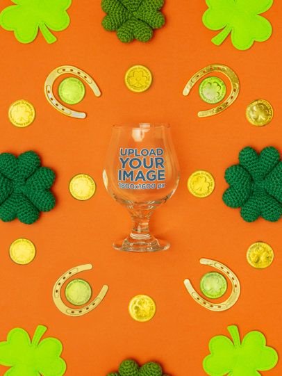 Mockup of a Tulip Glass Lying on a St. Patrick's Day-Themed Background