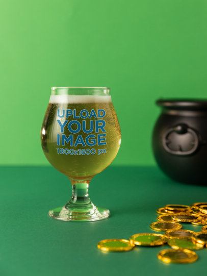 Mockup of a Tulip Glass Filled With Beer Placed on a St. Patrick's-Themed Set