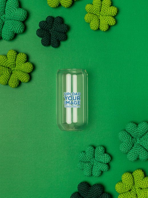 Mockup of a Beer Can Glass Lying on a St. Patrick's Day-Decorated Background