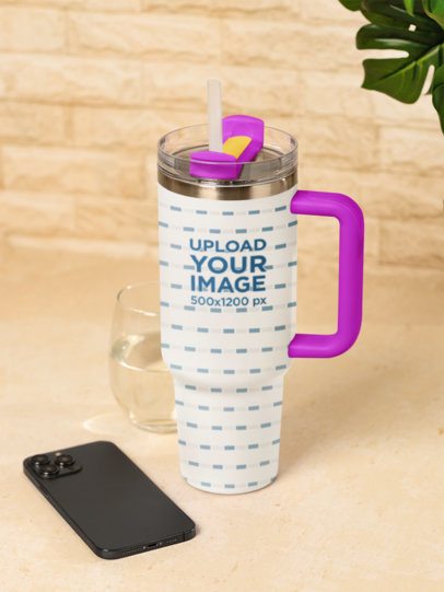 Drinkware Mockup Featuring a Stanley Tumbler Placed Next to a Smartphone